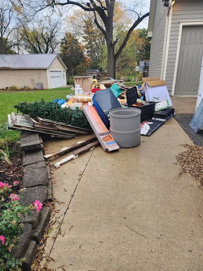 Dumpster being loaded with debris for Commercial Dumpster Rental in Castle Hills